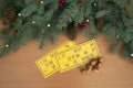 Christmas background. Christmas tree branches, cones of a lotto card with numbers and barrels. Success and good luck