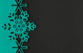 Christmas background with turquoise snowflakes and copy space on dark grey background Royalty Free Stock Photo
