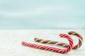 Christmas background. Two different Christmas candy canes, sleigh Royalty Free Stock Photo