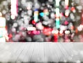 Christmas background vintage empty aged white wood panel above bokeh glitter light and snowfall on street night Royalty Free Stock Photo