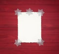 Christmas Background with Vintage Paper with ragged edges and Snowflake Decorations on Rustic, Shiplap Wood Boards with copy space