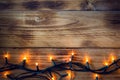 Christmas background - vintage planked wood with lights.