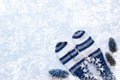 Christmas background with white and blue striped mittens, three Royalty Free Stock Photo