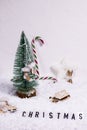 Christmas background on white snow with wooden toys sledges and skates