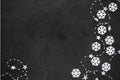 Christmas background: white snowflakes and garland on the black background. Top view. Flat lay Royalty Free Stock Photo