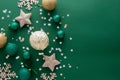 Christmas background with winter decorations, stars, baubles over green background Royalty Free Stock Photo