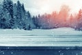 Christmas background with wooden empty table over winter nature landscape