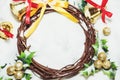 Christmas background, Wreath woven from the branch of the vine with golden bells and green leaf Royalty Free Stock Photo