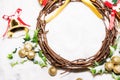 Christmas background, Wreath woven from the branch of the vine with golden bells and green leaf with golden ball Royalty Free Stock Photo
