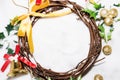 Christmas background, Wreath woven from the branch of the vine with golden bells and green leaf with golden ball Royalty Free Stock Photo