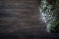 Christmas background with xmas tree, red berries on dark wooden Royalty Free Stock Photo