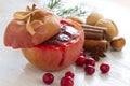 Christmas baked apple with cranberries, cinnamon and nuts, food christmas concept