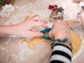 Christmas Bakery: Little girl cutting out dough for christmas cookies Royalty Free Stock Photo