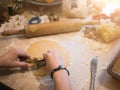 Christmas Bakery: Little girl cutting out guitar form for christmas cookies Royalty Free Stock Photo