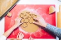 Christmas bakery. Mother and child making gingerbread,cutting cookies of gingerbread dough, view from above Royalty Free Stock Photo
