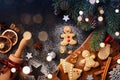 Christmas baking background. Gingerbread cookies, rolling pin and fir tree top view. Homemade pastries for winter holidays