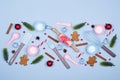 Ingredients for cooking christmas cookies, kitchen utensils, gingerbread cookies on blue pastel background. Royalty Free Stock Photo