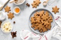 Christmas baking culinary background. Xmas gingerbread on kitchen table and ingredients for cooking festive cookies Royalty Free Stock Photo