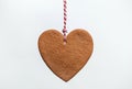 Heart shaped christmas gingerbread cookie on white background