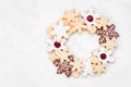 Christmas baking wreath arrangement with an assortment of snowflake cookies