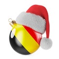 Christmas ball with Belgian flag and Santa Claus hat. Christmas and New Year in Belgium, concept. 3D rendering