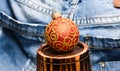 Christmas ball decor on little decorative wooden barrel over denim background. Winter holiday concept. Decorate Royalty Free Stock Photo