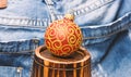 Christmas ball decor on little decorative wooden barrel over denim background. Winter holiday concept. Decorate Royalty Free Stock Photo