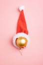 Christmas ball decoration with santa hat in snow Royalty Free Stock Photo