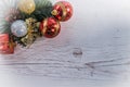 Christmas ball and decoration on a wooden board
