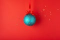 Christmas ball hanging on red ribbon. Royalty Free Stock Photo