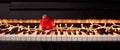 Christmas ball and lights on a piano keyboard, front view Royalty Free Stock Photo