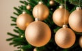 christmas ball mockup with copy space. beige golden christmas balls hung on fir tree. Christmas background baubles and branch of Royalty Free Stock Photo