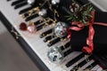 Christmas ball on piano keys. Carol music concept Royalty Free Stock Photo