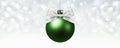 Christmas ball, silver satin ribbon bow on blurred bright lights Royalty Free Stock Photo
