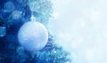 Christmas ball on a Christmas tree branch, closeup, soft selective focus. Blue christmas background with balls Royalty Free Stock Photo