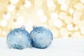 Christmas balls baubles gold golden stars background snow Royalty Free Stock Photo