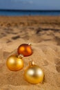 Christmas balls on beach Royalty Free Stock Photo