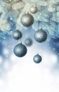 Christmas balls on a blue Christmas tree branch over blurred shiny background. Space for text Royalty Free Stock Photo