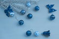 Christmas balls bows bells decorations and silver tree branches. Trendy concept color of the year 2020 Classic Blue. Royalty Free Stock Photo