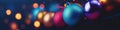 Christmas balls decorations on the Christmas tree on background. Selective focus with shallow depth of field. Royalty Free Stock Photo