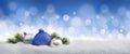 Christmas balls and fir twigs in the snow Royalty Free Stock Photo