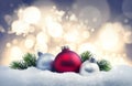 Christmas balls and fir twigs in the snow Royalty Free Stock Photo