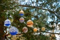 Christmas balls hanging on pine branches covered with snow Royalty Free Stock Photo