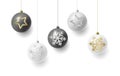 Christmas balls hanging on strings, white and black colour with silver and golden illustrations of snowflakes and stars