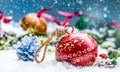 Christmas balls jingle bells. Red ribbon with text Happy Christmas. Snowy abstract background and decoration Royalty Free Stock Photo