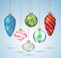 Christmas balls ornaments hanging on gold thread. Royalty Free Stock Photo