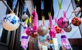 Christmas Balls Ornaments and wet socks hanging on the clothing clips on the  Clothes Drying Rack. Royalty Free Stock Photo