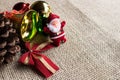 christmas balls and ribbon on red background