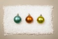 3 christmas balls in row on snow background Royalty Free Stock Photo