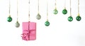 Christmas balls in a row, wrapped present, on white background, merry christmas,free copy space Royalty Free Stock Photo